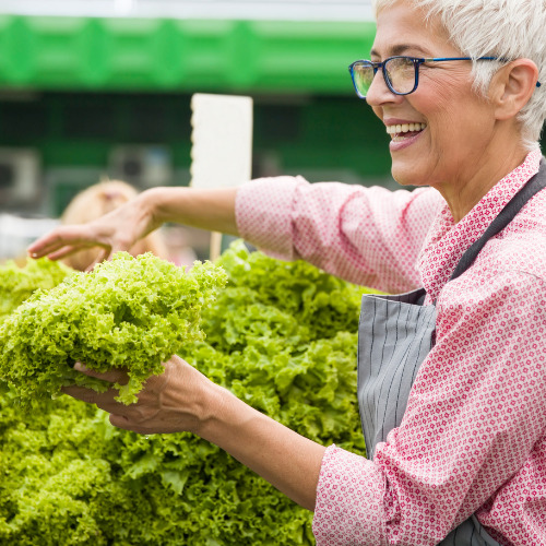 Happy customer selecting produce